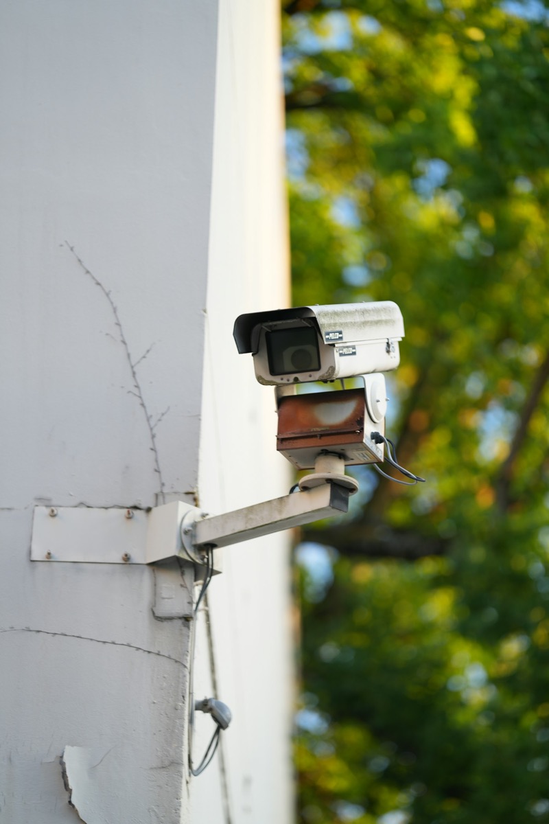 Security camera mounted on a building wall